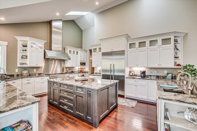 28 Evans Dr, Cranbury, NJ 08512 - kitchen featuring open shelves, built in refrigerator, high vaulted ceiling, a sink, and wall chimney exhaust hood