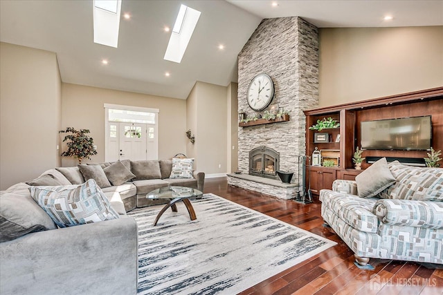 28 Evans Dr, Cranbury, NJ 08512 - living room featuring a fireplace, wood finished floors, a skylight, high vaulted ceiling, and recessed lighting