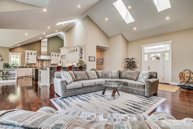 28 Evans Dr, Cranbury, NJ 08512 - living area with a skylight, high vaulted ceiling, dark wood-type flooring, recessed lighting, and baseboards