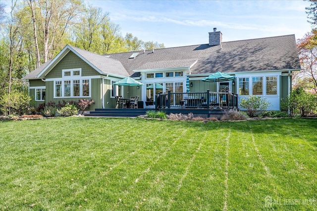 28 Evans Dr, Cranbury, NJ 08512 - rear view of property with a deck, board and batten siding, a chimney, and a lawn