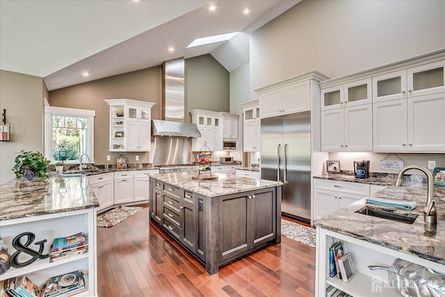 28 Evans Dr, Cranbury, NJ 08512 - kitchen featuring stainless steel built in fridge, a sink, wall chimney exhaust hood, open shelves, and high vaulted ceiling