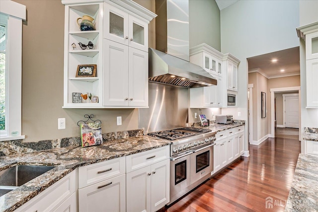 28 Evans Dr, Cranbury, NJ 08512 - kitchen featuring appliances with stainless steel finishes, wall chimney exhaust hood, ornamental molding, plenty of natural light, and wood finished floors