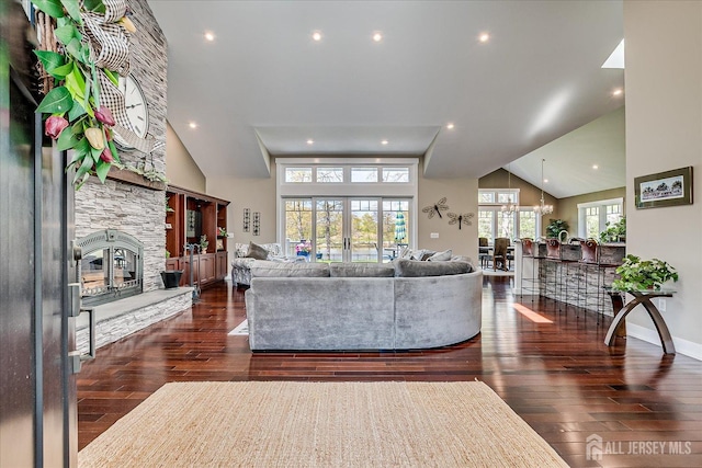 28 Evans Dr, Cranbury, NJ 08512 - living room featuring a stone fireplace, wood finished floors, a chandelier, high vaulted ceiling, and recessed lighting