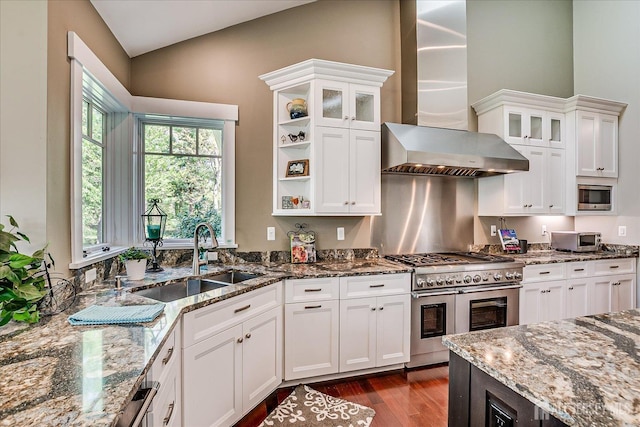 28 Evans Dr, Cranbury, NJ 08512 - kitchen featuring appliances with stainless steel finishes, wall chimney exhaust hood, a sink, dark wood-type flooring, and white cabinets