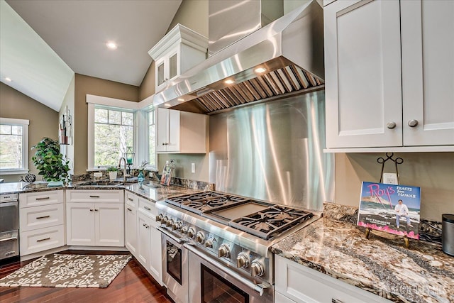 28 Evans Dr, Cranbury, NJ 08512 - kitchen with range with two ovens, extractor fan, a sink, light stone counters, and white cabinetry