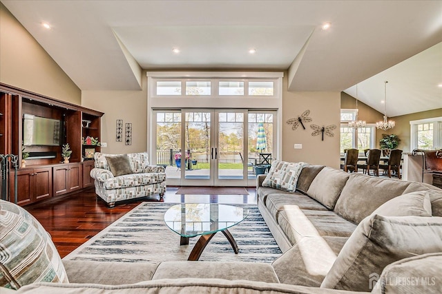 28 Evans Dr, Cranbury, NJ 08512 - living room with a chandelier, vaulted ceiling, dark wood-style flooring, and french doors