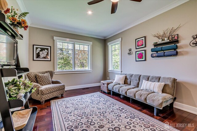 28 Evans Dr, Cranbury, NJ 08512 - living area with crown molding, a ceiling fan, wood finished floors, and baseboards