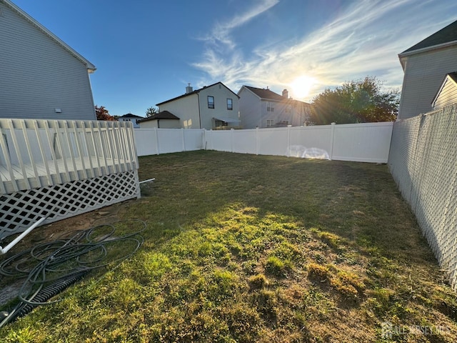 view of yard featuring a wooden deck