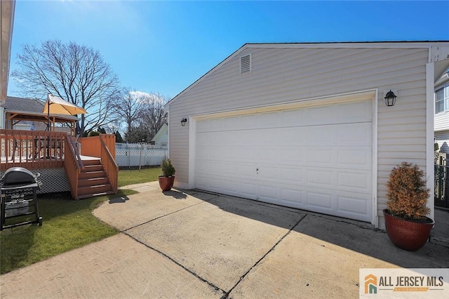 garage with fence