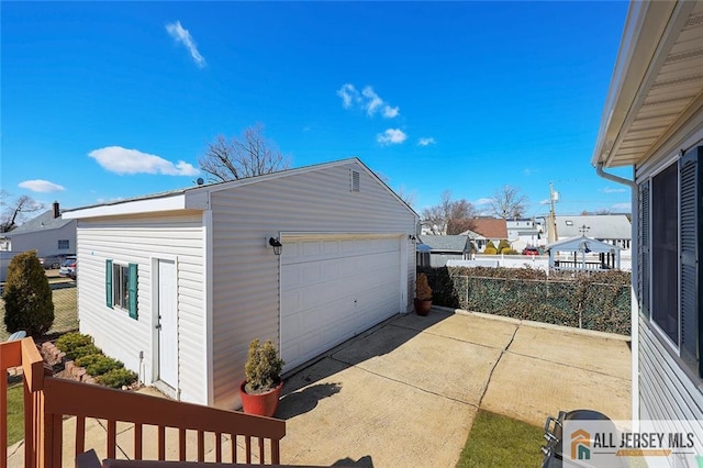 detached garage with fence