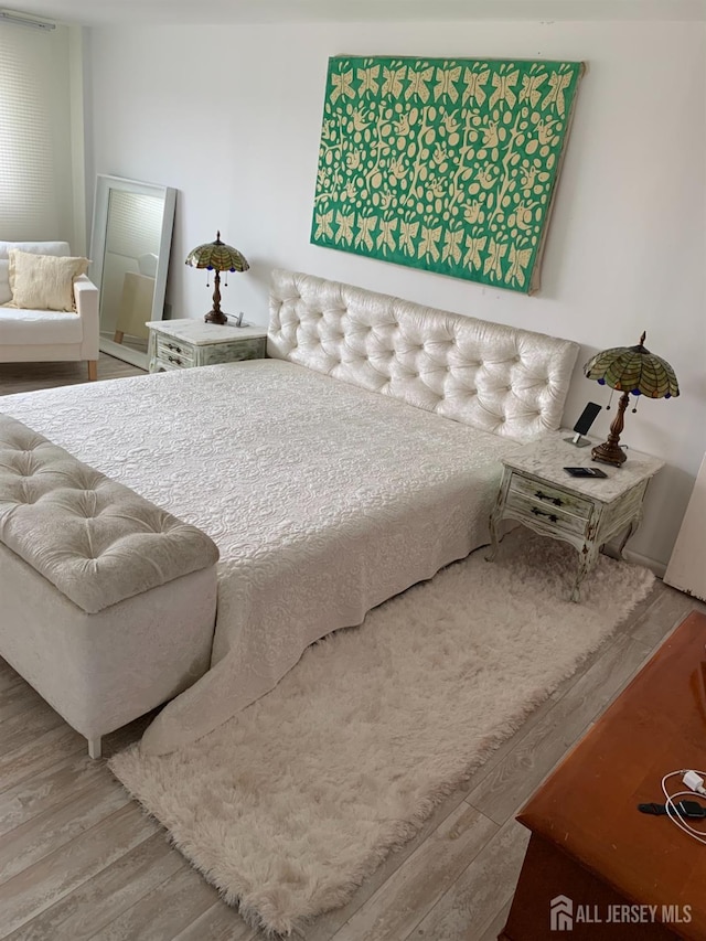 bedroom featuring wood finished floors