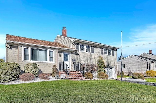 tri-level home featuring a chimney and a front yard