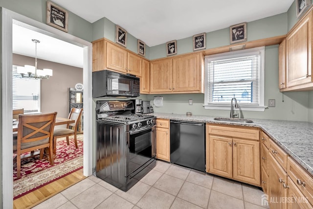 kitchen with a chandelier, black appliances, a sink, and light brown cabinets