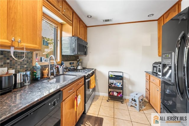 156 George St, New Brunswick, NJ 08901 - kitchen featuring black appliances, tasteful backsplash, a sink, brown cabinetry, and crown molding