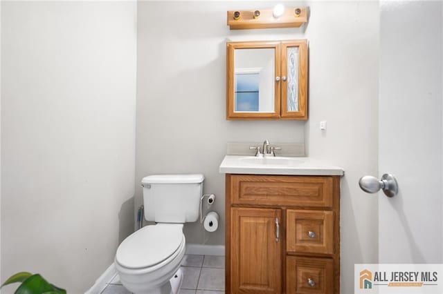 156 George St, New Brunswick, NJ 08901 - bathroom with tile patterned flooring, toilet, vanity, and baseboards