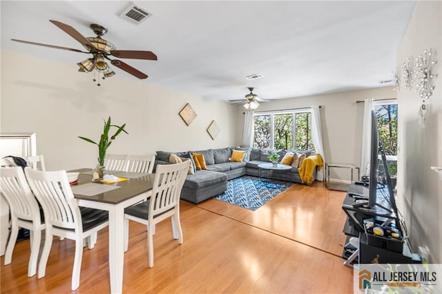 156 George St, New Brunswick, NJ 08901 - dining area with ceiling fan and light wood-style floors