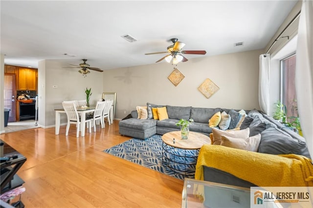 156 George St, New Brunswick, NJ 08901 - living room with ceiling fan and light wood-style floors