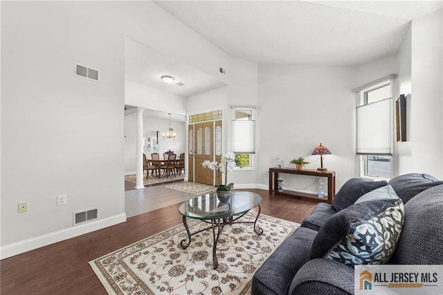 24 Birmingham Ln, Monroe, NJ 08831 - living area featuring wood finished floors, a chandelier, ornate columns, and cooling unit