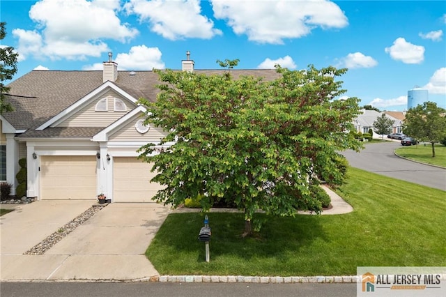 24 Birmingham Ln, Monroe, NJ 08831 - view of front of home featuring a front lawn, concrete driveway, a chimney, and a shingled roof