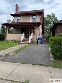 117 Freeman St, Woodbridge Proper, NJ 07095 - view of front of house with a porch and a chimney