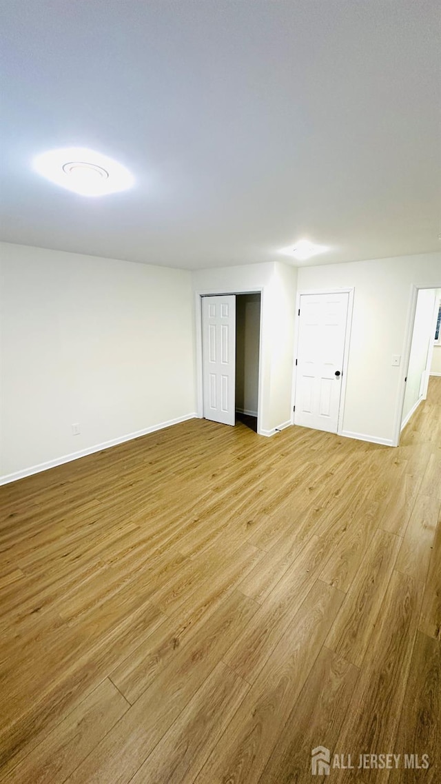7 Harper Rd, South Brunswick, NJ 08852 - spare room with light wood finished floors and baseboards