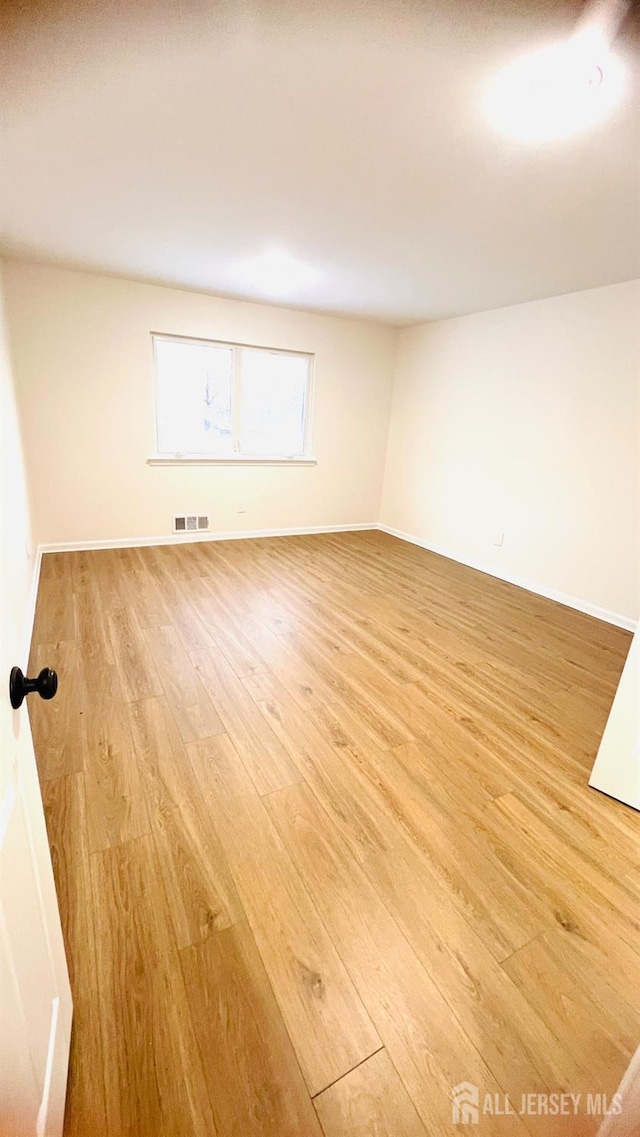7 Harper Rd, South Brunswick, NJ 08852 - unfurnished room with light wood-style flooring and baseboards