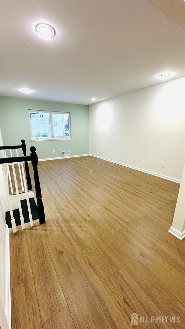 basement featuring light hardwood / wood-style flooring