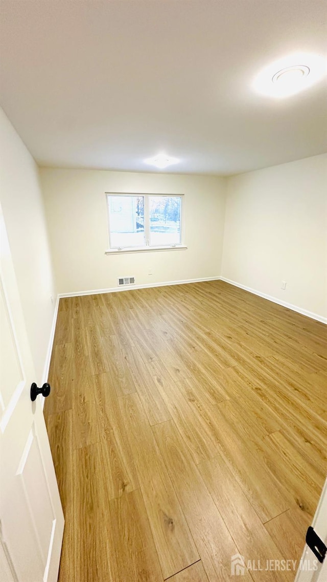 unfurnished room featuring light hardwood / wood-style floors