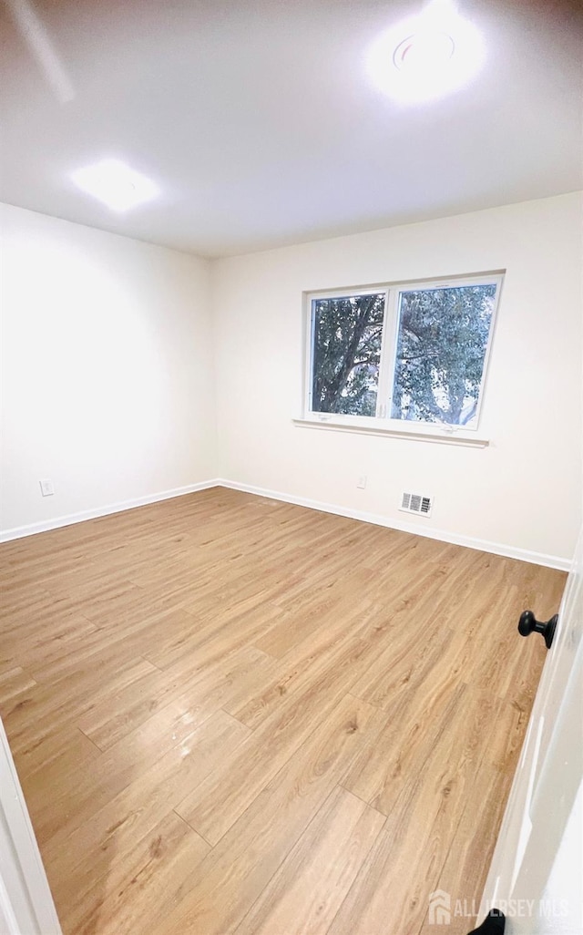 7 Harper Rd, South Brunswick, NJ 08852 - spare room with light wood-style floors and baseboards