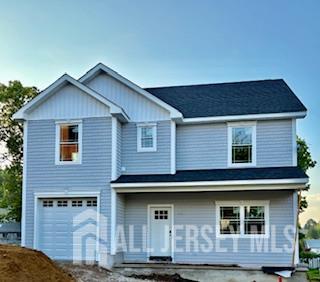 526 Catherine St, South Amboy, NJ 08879 - view of front facade featuring a garage and covered porch