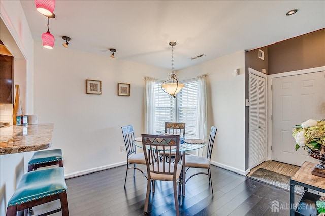55 Renaissance Ln, New Brunswick, NJ 08901 - dining room featuring dark wood-style flooring and baseboards