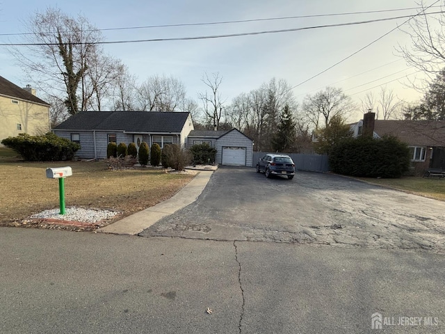 view of front of house with a garage and aphalt driveway