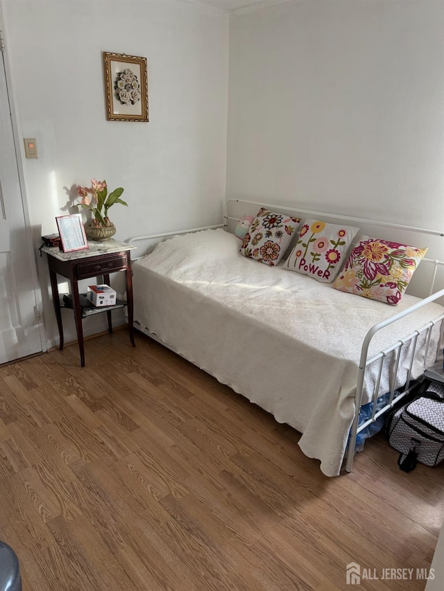 bedroom featuring wood finished floors