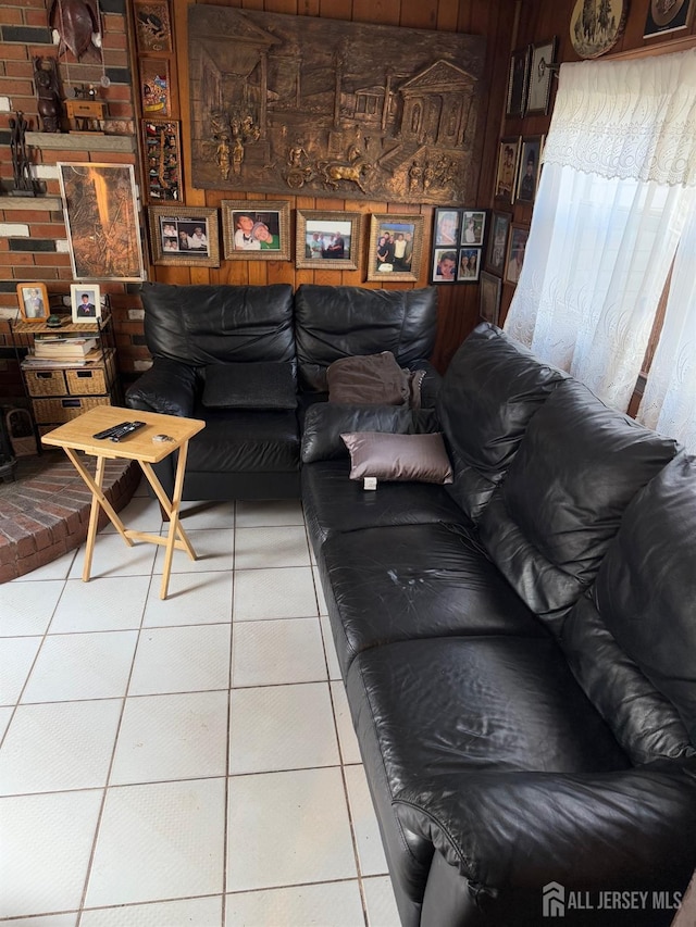 living area with tile patterned floors