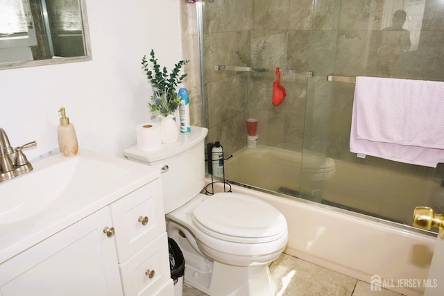 full bathroom featuring enclosed tub / shower combo, vanity, and toilet