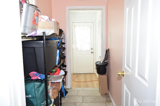 interior space featuring laundry area and baseboards