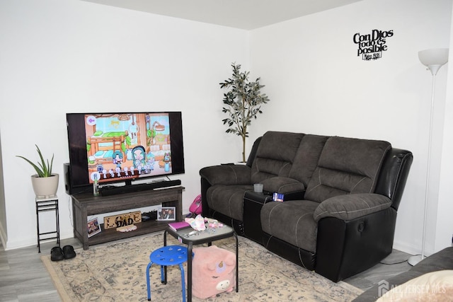 living room featuring light wood-style flooring and baseboards