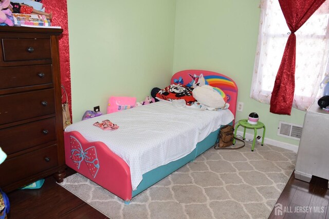 bedroom featuring light hardwood / wood-style floors