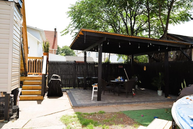 view of patio / terrace featuring fence