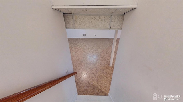 28 Elm St, East Brunswick, NJ 08816 - hallway featuring tile patterned flooring and baseboards