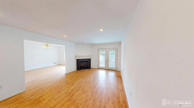 28 Elm St, East Brunswick, NJ 08816 - unfurnished living room with light wood-style flooring, a fireplace, a chandelier, and recessed lighting