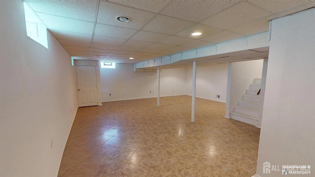 28 Elm St, East Brunswick, NJ 08816 - below grade area featuring stairway and a paneled ceiling