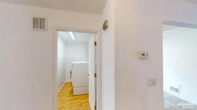 28 Elm St, East Brunswick, NJ 08816 - hall featuring separate washer and dryer and light wood-style floors
