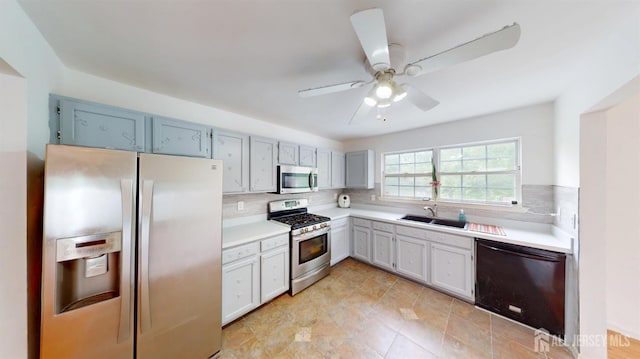 28 Elm St, East Brunswick, NJ 08816 - kitchen featuring appliances with stainless steel finishes, decorative backsplash, light countertops, and a ceiling fan