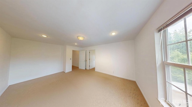 28 Elm St, East Brunswick, NJ 08816 - empty room with recessed lighting and light carpet