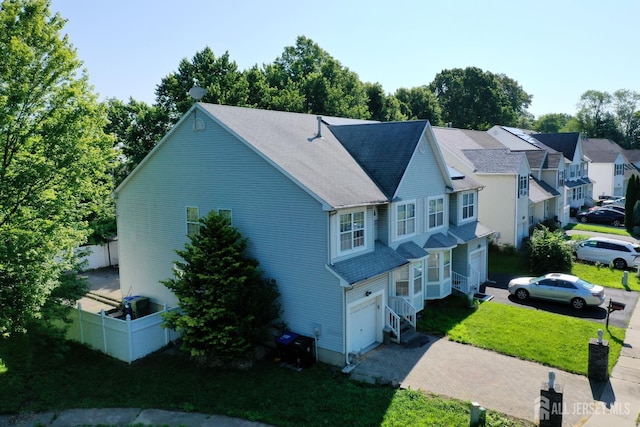 28 Elm St, East Brunswick, NJ 08816 - view of front facade featuring a garage and driveway