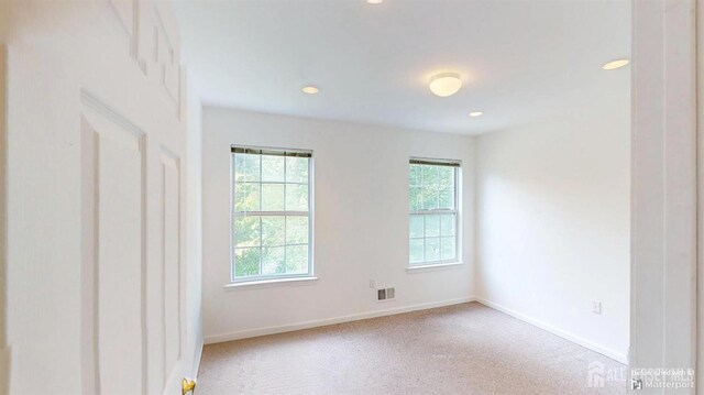 28 Elm St, East Brunswick, NJ 08816 - empty room with baseboards and recessed lighting