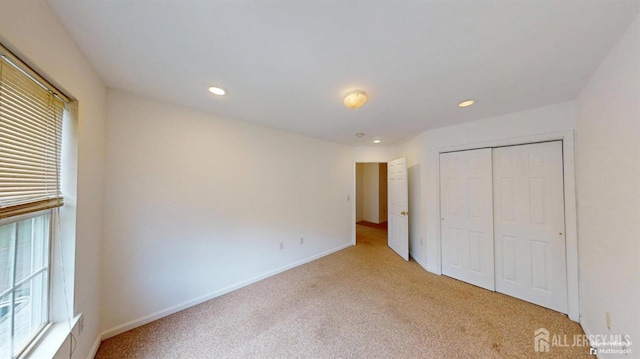 28 Elm St, East Brunswick, NJ 08816 - unfurnished bedroom featuring light colored carpet, a closet, and recessed lighting