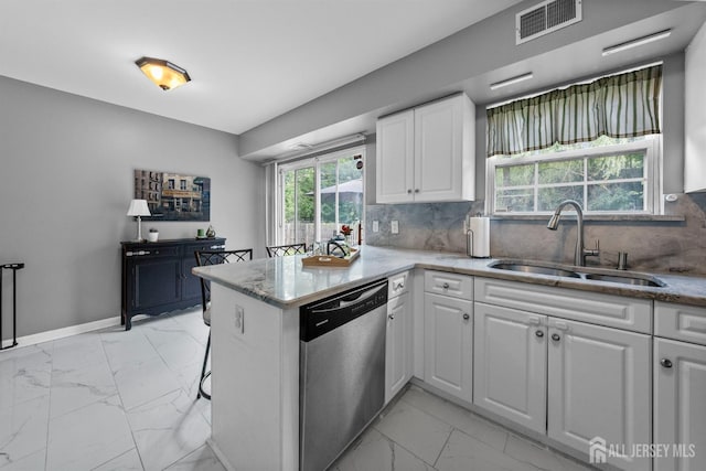 41 Haymarket Ct, East Windsor, NJ 08512 - kitchen with stainless steel dishwasher, light marble finish floors, a peninsula, white cabinetry, and light stone counters
