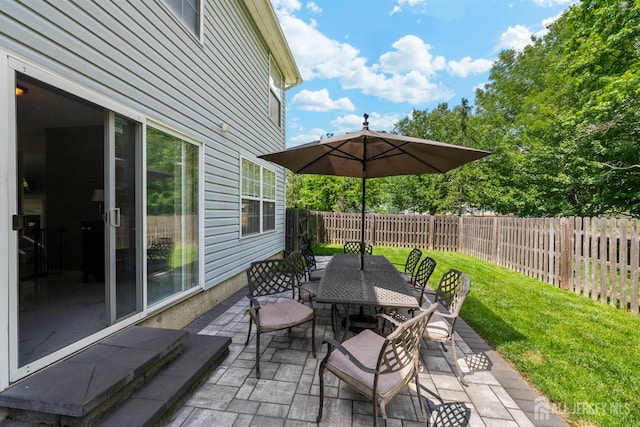 41 Haymarket Ct, East Windsor, NJ 08512 - fenced backyard featuring outdoor dining space and a patio